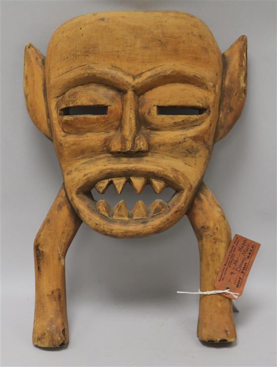 A Tanzania tribal mask, with old label for Universities Mission to Central Africa